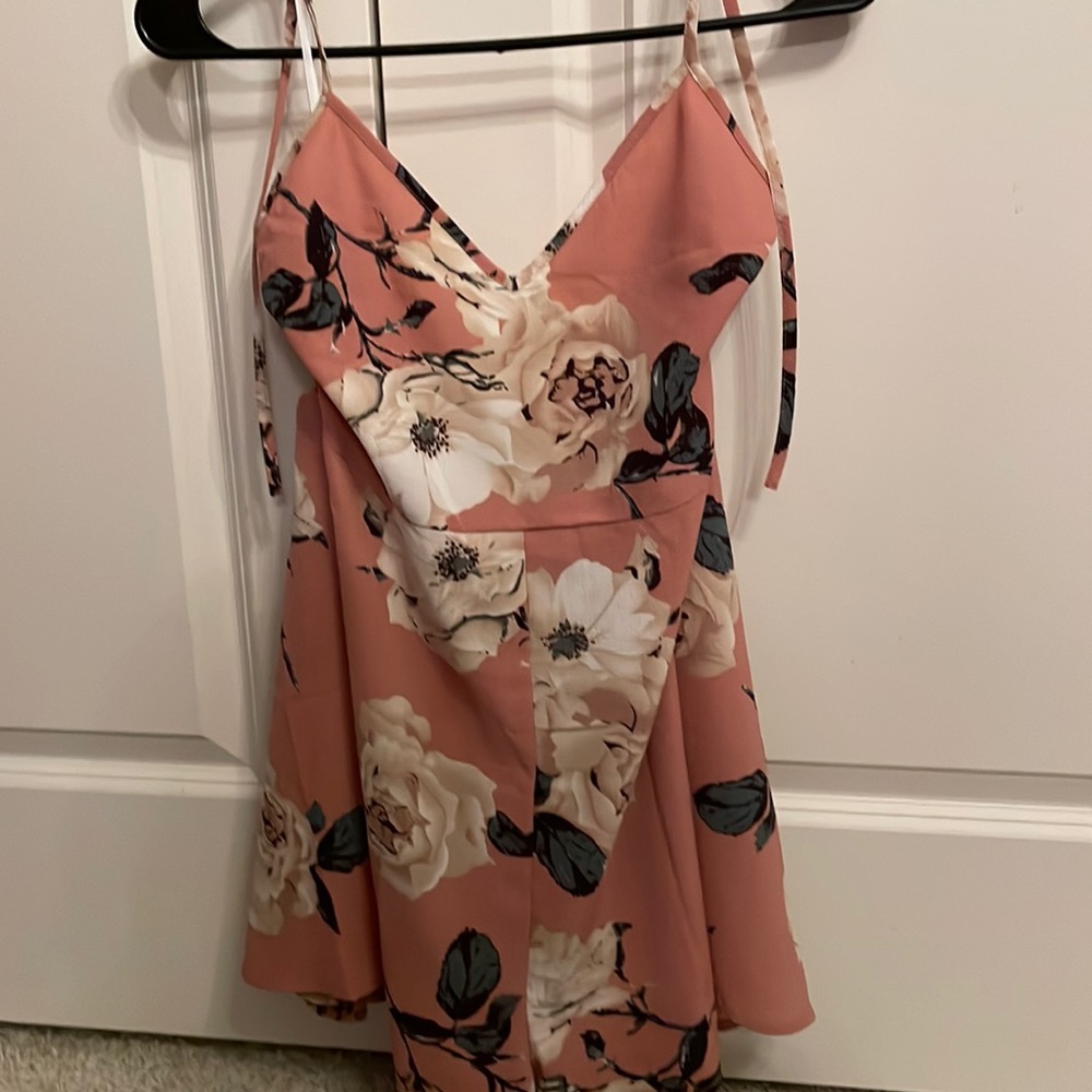 pink romper with floral pattern